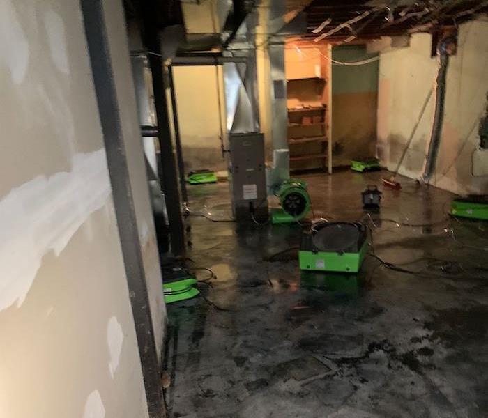 Floor in a basement with SERVPRO drying equipment