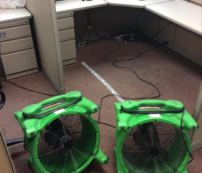 two axial fans drying office cubicles
