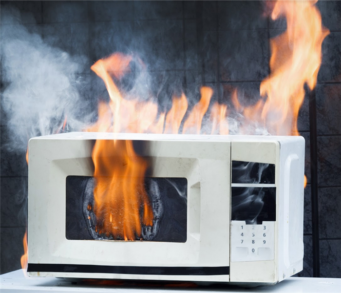 a microwave that is on fire
