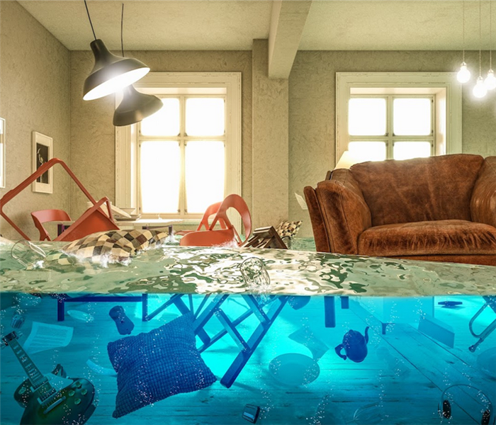 a flooded living room with belongings floating everywhere